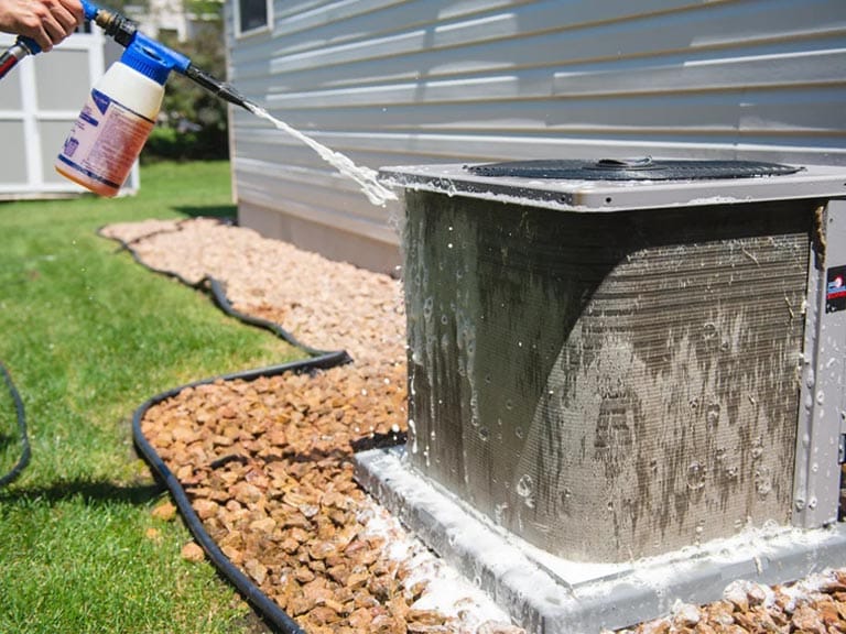 The Best Time of Year for Air Duct Cleaning in Raleigh 2 Homeowner preparing HVAC for fall duct cleaning in Apex, NC