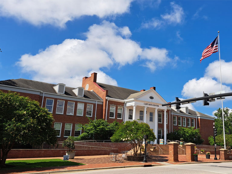 Downtown Cary NC streetscape with townhomes, restaurants, and small businesses—ideal for professional air duct and dryer vent cleaning